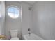 Bathroom featuring a shower and a unique circular window at 2485 Greensborough Cir, Highlands Ranch, CO 80129