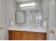 Bathroom with a dual vanity, sinks, and mirrors at 2485 Greensborough Cir, Highlands Ranch, CO 80129