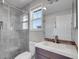 Bathroom featuring a shower, vanity, toilet, and window at 2485 Greensborough Cir, Highlands Ranch, CO 80129