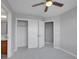 Neutral bedroom showcasing a closet and door at 2485 Greensborough Cir, Highlands Ranch, CO 80129