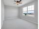 Bedroom with a ceiling fan and a bright window at 2485 Greensborough Cir, Highlands Ranch, CO 80129