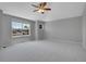 Spacious bedroom with large windows providing plenty of natural light and neutral carpet at 2485 Greensborough Cir, Highlands Ranch, CO 80129