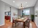 Dining room with a table set for six near the kitchen at 2485 Greensborough Cir, Highlands Ranch, CO 80129