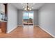 Dining room featuring hardwood floors and sliding doors to an outdoor deck with a scenic view at 2485 Greensborough Cir, Highlands Ranch, CO 80129