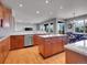 Open kitchen featuring a center island, granite countertops and stainless steel appliances at 2485 Greensborough Cir, Highlands Ranch, CO 80129