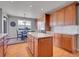 Spacious kitchen with an island and a dining area with large windows at 2485 Greensborough Cir, Highlands Ranch, CO 80129