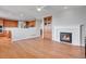 Open living space featuring a fireplace and views of the kitchen at 2485 Greensborough Cir, Highlands Ranch, CO 80129
