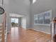 Open-concept living room with hardwood floors, recessed lighting, and access to the outdoor deck at 2485 Greensborough Cir, Highlands Ranch, CO 80129