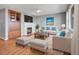 Cozy living room with a fireplace, built-in cabinet, and plush seating at 2485 Greensborough Cir, Highlands Ranch, CO 80129
