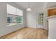 Dining area with hardwood floors and large window at 7440 S Blackhawk St # 101, Englewood, CO 80112