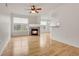 Light and airy living room with hardwood floors and fireplace at 7440 S Blackhawk St # 101, Englewood, CO 80112