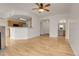 Living room with hardwood floors and kitchen bar at 7440 S Blackhawk St # 101, Englewood, CO 80112