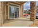 Private patio with sliding glass door access at 7440 S Blackhawk St # 101, Englewood, CO 80112