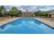 Inviting community swimming pool with lounge chairs at 7440 S Blackhawk St # 101, Englewood, CO 80112