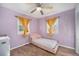 Inviting bedroom featuring a cozy single bed and soft, lavender-colored walls at 9450 Lillian Ln, Thornton, CO 80229