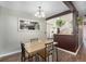 Bright dining area adjacent to the kitchen features stylish lighting and seamless transition into the kitchen at 9450 Lillian Ln, Thornton, CO 80229