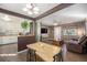 Bright and open concept floor plan seamlessly connects the dining area and living room to the kitchen at 9450 Lillian Ln, Thornton, CO 80229