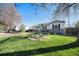 Charming home with green lawn and garden details at 9450 Lillian Ln, Thornton, CO 80229