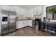 Efficiently designed kitchen with stainless steel appliances, ample cabinet space, and hardwood floors at 9450 Lillian Ln, Thornton, CO 80229