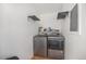 Practical laundry room with modern washer and dryer at 9450 Lillian Ln, Thornton, CO 80229