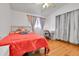 Comfortable bedroom featuring wood floors and neutral walls at 2580 Valley View Dr, Denver, CO 80221