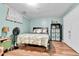 Simple bedroom with a queen bed and laminate wood flooring at 2580 Valley View Dr, Denver, CO 80221