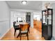Large dining room with hardwood floors, open to kitchen at 2580 Valley View Dr, Denver, CO 80221