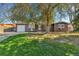 Charming single-story home with mature landscaping and a well-maintained front yard at 2580 Valley View Dr, Denver, CO 80221