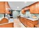 Bright kitchen featuring wood cabinets, granite countertops and stainless steel appliances at 2580 Valley View Dr, Denver, CO 80221