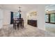 Cozy dining room with a wooden dining set and natural light from the window at 8144 W 81St Dr, Arvada, CO 80005
