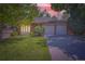 Charming single-story home with a well-manicured lawn and a two-car garage at 8144 W 81St Dr, Arvada, CO 80005
