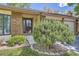 Inviting home exterior with brick accents, lush landscaping, and a well-maintained front yard at 8144 W 81St Dr, Arvada, CO 80005