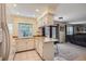 Bright and functional kitchen with modern appliances and a view into the living area at 8144 W 81St Dr, Arvada, CO 80005