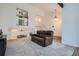 Bright living room with a vaulted ceiling and a comfortable leather sofa at 8144 W 81St Dr, Arvada, CO 80005