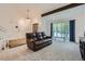 Spacious living room with large windows, accent beams and new carpet, perfect for Gathering gatherings at 8144 W 81St Dr, Arvada, CO 80005