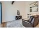 Bright living room with vaulted ceilings, accent beam, and second story opening to another room at 8144 W 81St Dr, Arvada, CO 80005