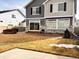 The backyard boasts a concrete patio, and a well-maintained lawn, perfect for outdoor activities and relaxation at 21901 E 42Nd Pl, Aurora, CO 80019