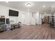 Finished basement featuring modern flooring, recreational space, and ample storage options at 21901 E 42Nd Pl, Aurora, CO 80019