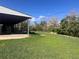 Spacious backyard featuring a lush green lawn and mature trees at 10885 Mildred Dr, Northglenn, CO 80233