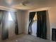 Bedroom with green curtains at 10885 Mildred Dr, Northglenn, CO 80233
