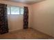 Bedroom with floral curtains covering the window at 10885 Mildred Dr, Northglenn, CO 80233