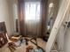 Bedroom featuring carpet flooring, natural light, and closet storage at 10885 Mildred Dr, Northglenn, CO 80233