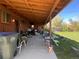 Large covered patio for relaxation and storage, with ample room for seating at 10885 Mildred Dr, Northglenn, CO 80233