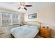 Cozy bedroom with a ceiling fan and a comfortable bed at 12704 Leyden St # D, Thornton, CO 80602