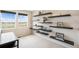 Bonus room with floating shelves and a large window overlooking the neighborhood at 12704 Leyden St # D, Thornton, CO 80602