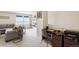Open bonus room with a desk area and a comfortable sectional sofa for lounging at 12704 Leyden St # D, Thornton, CO 80602