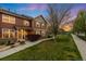 Charming two-story townhome with a well-manicured lawn and beautiful landscaping in a serene neighborhood at 12704 Leyden St # D, Thornton, CO 80602