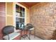 Cozy front porch with seating area, perfect for relaxing and enjoying the neighborhood ambiance at 12704 Leyden St # D, Thornton, CO 80602