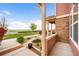 Inviting covered porch area with scenic views and attractive landscaping, offering a peaceful outdoor space at 12704 Leyden St # D, Thornton, CO 80602