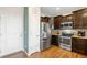 Spacious kitchen includes stainless steel appliances, dark cabinets, and adjacent breakfast area at 12704 Leyden St # D, Thornton, CO 80602